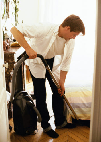 man father doing chores at home