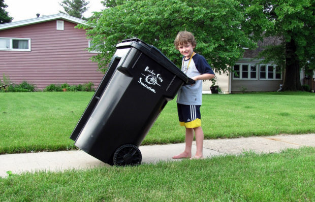 taking out the trash - boy outside